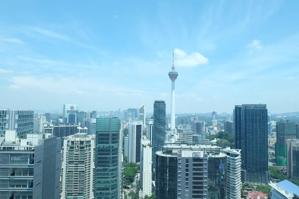 Kuala Lumpur skyline with Menara Kuala Lumpur under a blue sky